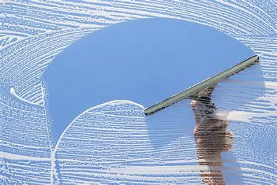 squeegee cleaning window at Maungatapu window cleaning services